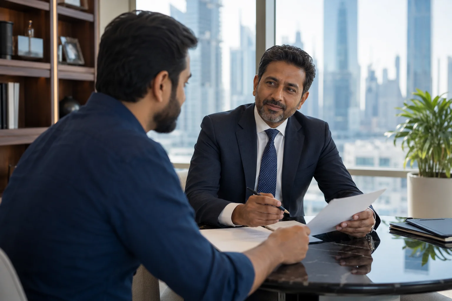 Tax advisor reviewing corporate tax strategy with a client in a Dubai office